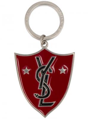 Брелок для ключей в виде щита YSL Saint Laurent. Цвет: металлический