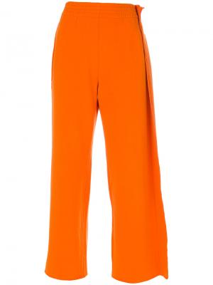 Расклешенные спортивные брюки Mm6 Maison Margiela. Цвет: жёлтый и оранжевый