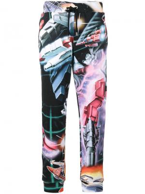Спортивные брюки с изображением трансформеров Moschino. Цвет: многоцветный