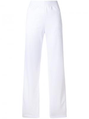 Спортивные брюки с логотипом сбоку Givenchy. Цвет: белый