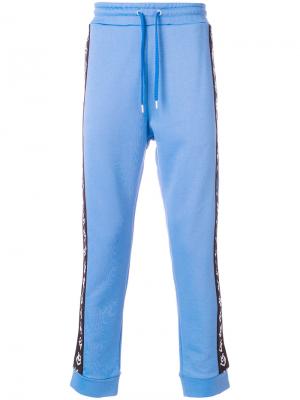 Спортивные брюки с лампасами Love Moschino. Цвет: синий